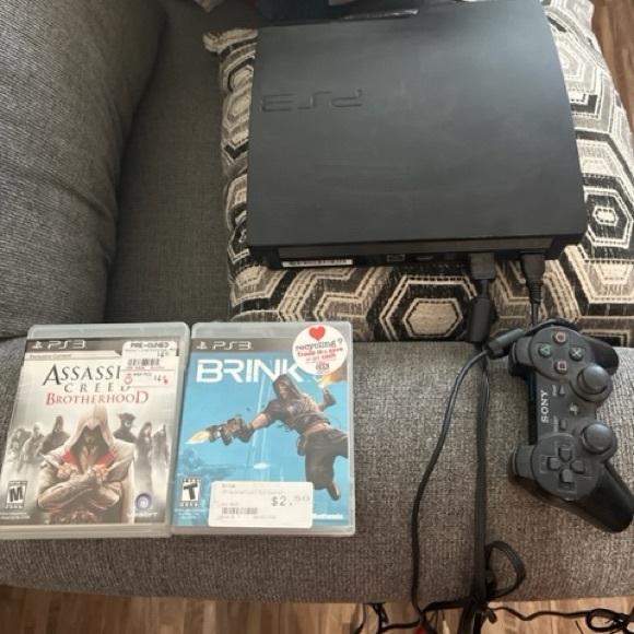 PS3 with two games, and original controller and cords